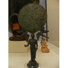 Mirror supported by a woman holding a dove